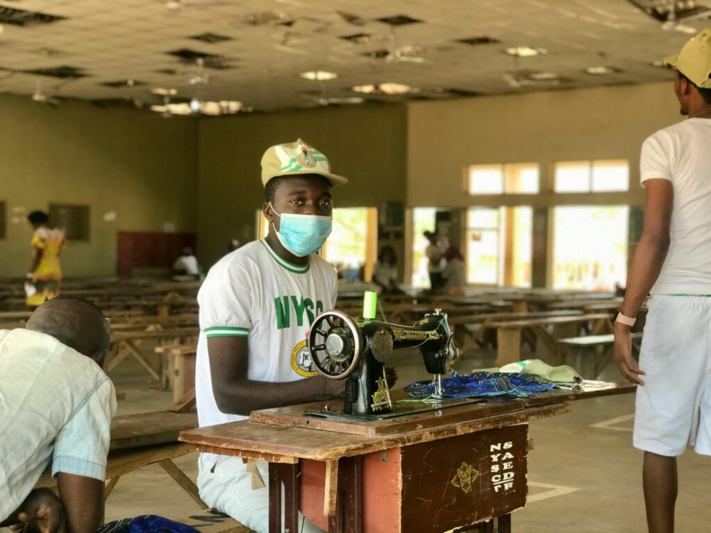 A corper learning a skill taught in the NYSC camp.
